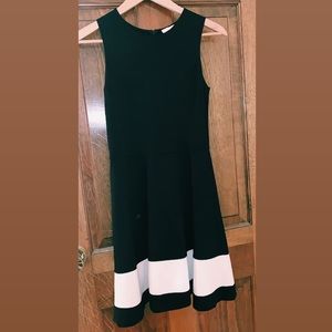 Black dress with a white strip